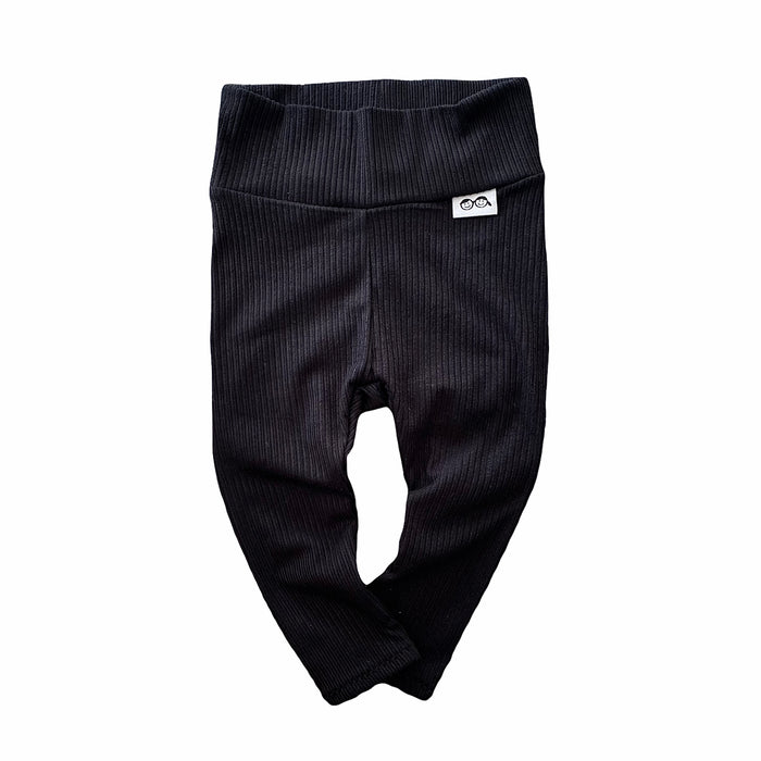 Baby black ribbed leggings – soft, stretchy, and cozy for newborns, infants, and toddlers. Perfect for everyday wear, these gender-neutral pants offer comfort and style. Handmade with love, available in sizes preemie to 4T. Ideal for layering with sweaters, onesies, or tees. A must-have for trendy baby outfits!