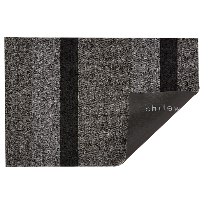 Wonderfully striped, the textured "looped" look of this shag mat is tufted from durable extruded yarns.