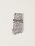 A pair of heathered charcoal socks with a bow detail, laid out on a plain background.