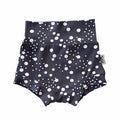 Handmade polka dot bummies for babies and toddlers, featuring a stylish black and white design. Soft, comfortable, and perfect as a diaper cover or for everyday wear. Ideal for active little ones and special occasions alike.