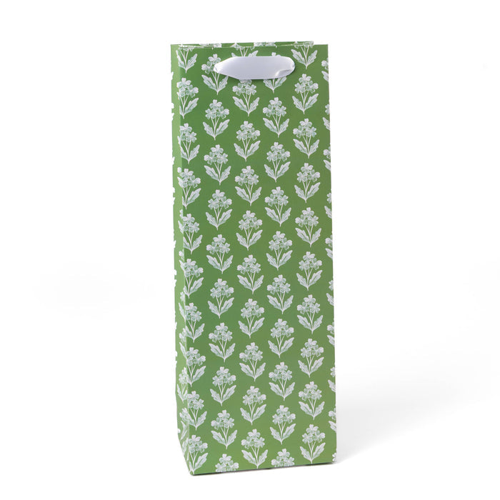 Green gift bag with white floral pattern on a white background