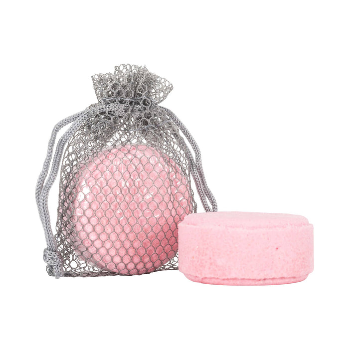 Pink shower steamer inside and out of mesh bag against white background