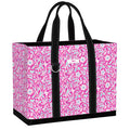 Pink floral patterned tote bag with black handles on a white background