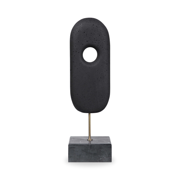 The monolithium shape is executed in ground black marble and polymers with a honed black marble base and brass pegs.