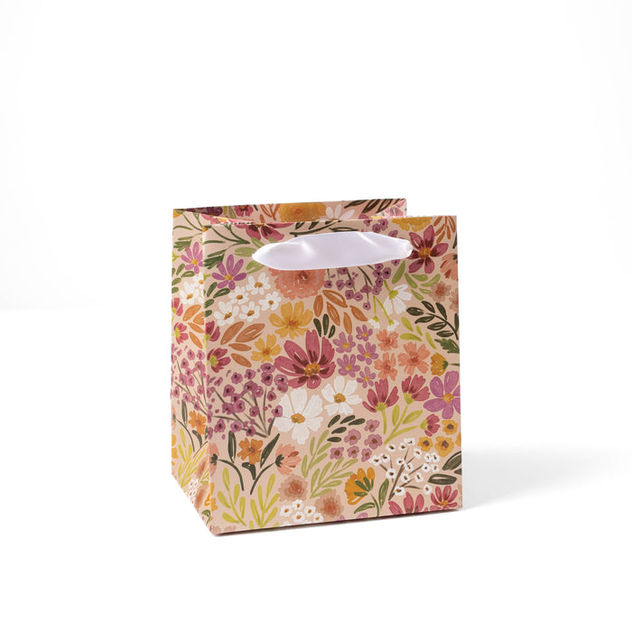Floral-patterned gift bag on a white background