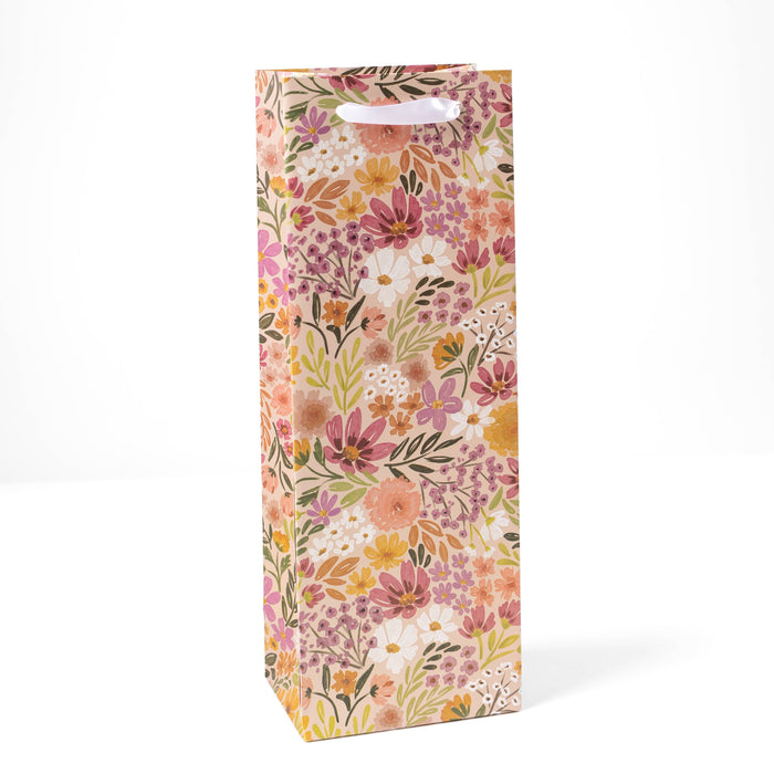 Floral patterned gift bag on a white background
