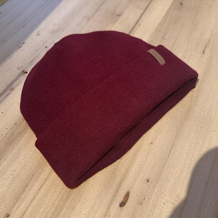 Swimbler Burgundy Waterproof Beanie with embossed logo and triple-layer waterproof protection, ideal for cold weather and open-water use.