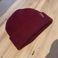 Swimbler Burgundy Waterproof Beanie with embossed logo and triple-layer waterproof protection, ideal for cold weather and open-water use.